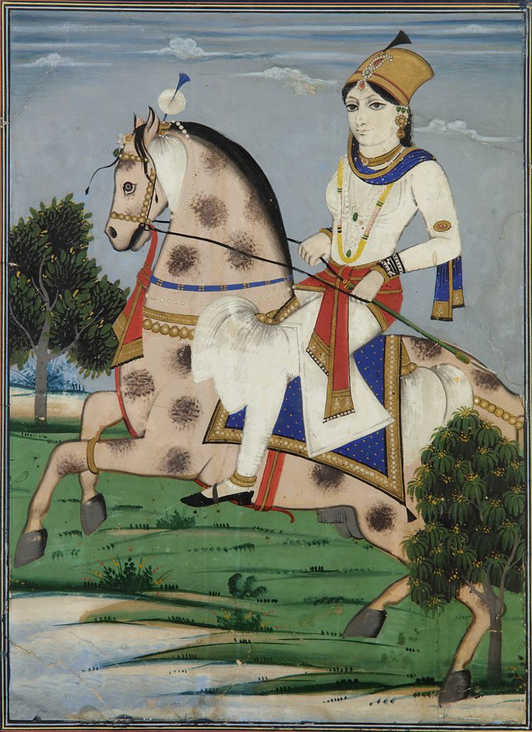 Indian princess riding a dapple gray horse