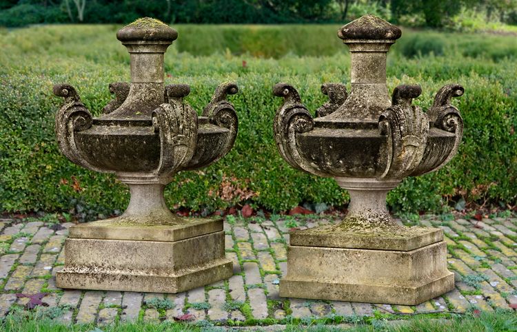 A PAIR OF LARGE EDWARDIAN CARVED LIMESTONE URN FINIALS, EARLY 20TH CENTURY