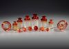 A TOILETSET OF CRANBERRY BACCARAT, CIRCA 1880