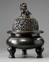 A large Chinese bronze tripod censer
