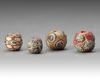 A GROUP OF FOUR GLASS BEADS ROMAN, 1ST CENTURY AD