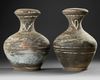 A PAIR OF PAINTED TERRACOTTA HU VASES WITH COVERS, CHINA, HAN DYNASTY (206 BC-220 AD)