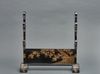 A Japanese black lacquered sword stand (katanakake) for five swords
