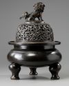A large Chinese bronze tripod censer