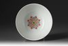 A famille rose ruby-ground medallion bowl