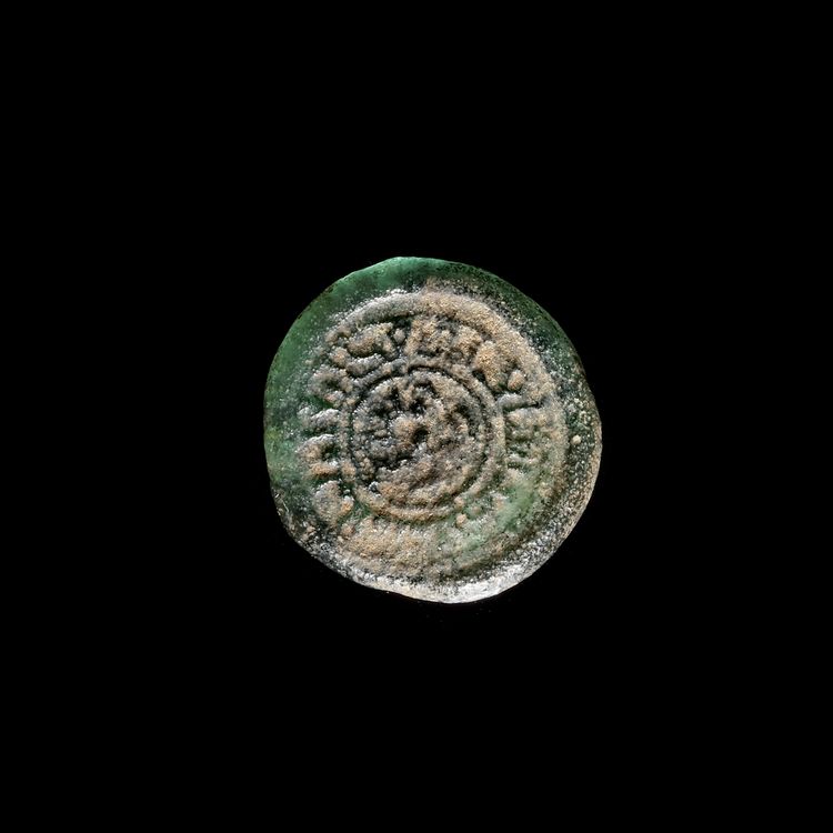 A FATIMID GLASS WEIGHT OF DIRHAM, EGYPT AL-MUSTANSIR BI-ALLAH (AH 427-487 / 1036-1094 AD)