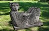 A CARVED LIMESTONE FIGURAL GARDEN SEAT IN THE MESO AMERICAN STYLE, EARLY 20TH CENTURY