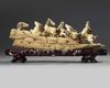 A Chinese carved ivory 'Eight Horses of Mu Wang' group