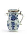 A Chinese blue and white moulded jug with European silver mounts