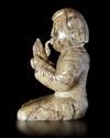 A CREAMY WHITE JADE OF A SHENG-PLAYING MUSICIAN, CHINA, HAN DYNASTY (206 BC-220 AD)