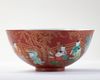 A FINE CORAL-GROUND FAMILLE VERTE 'BOYS' BOWL