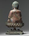 A Chinese gilt-lacquered bronze figure of Shakyamuni