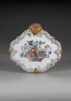A POLYCHROME PLAQUETTE WITH FLOWER BASKET, CA 1740 DELFT