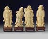 A group of four Chinese carved ivory Luohan