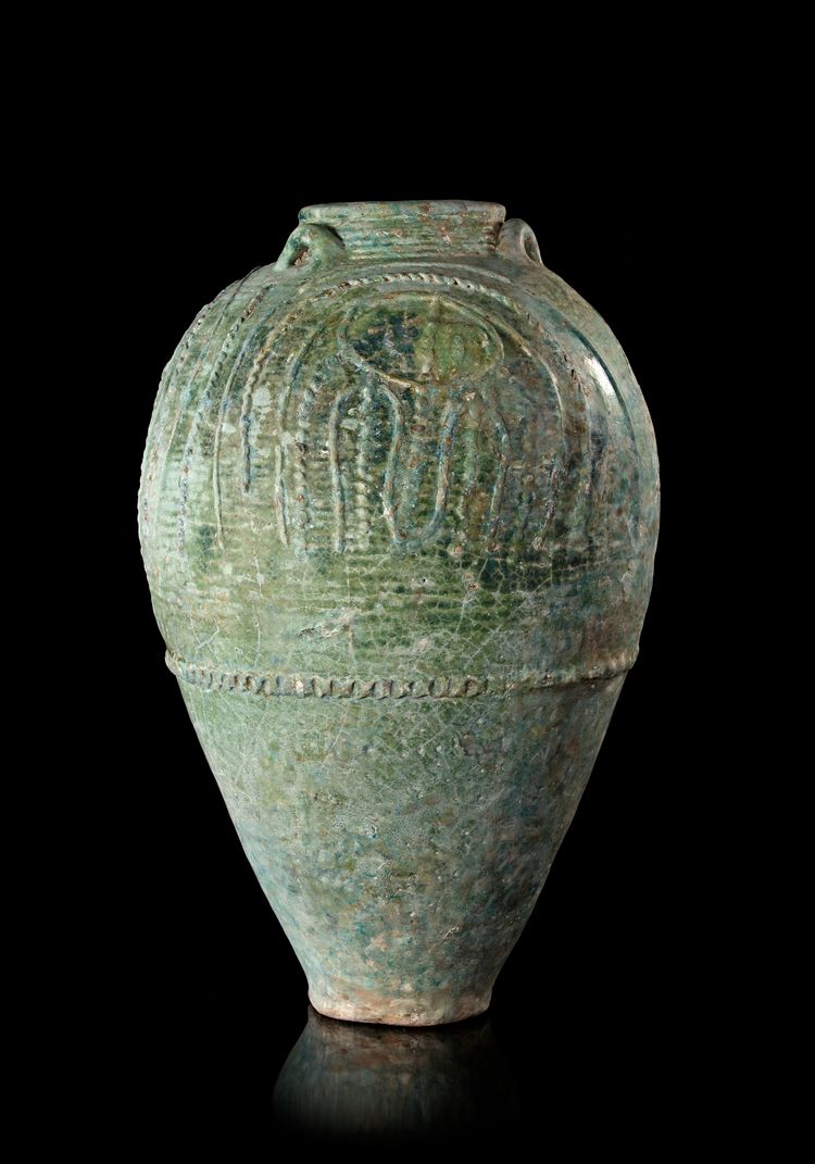 A LARGE UMAYYAD TURQUOISE-GREEN GLAZED JAR, MESOPOTAMIA, 7TH-8TH CENTURY