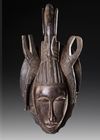 AN AFRICAN MASK WITH BIRD CREST, EARLY 20TH CENTURY