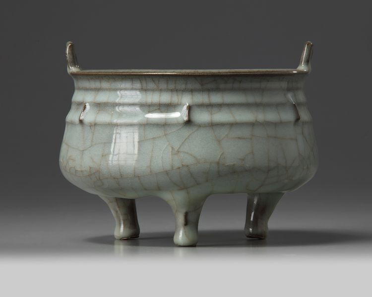 A Chinese celadon crackle-glazed tripod censer