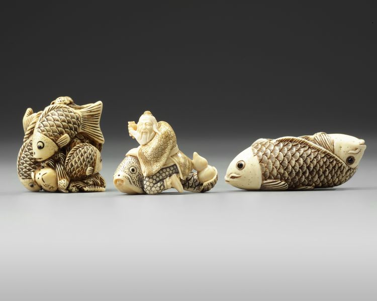 A GROUP OF THREE JAPANESE IVORY NETSUKES, 20TH CENTURY