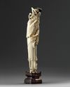 A Chinese ivory carving of a lady holding a flower basket