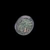 AN EARLY ISLAMIC GLASS WEIGHT OF QUARTER DIRHAM