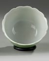 A Chinese pale-green glazed moulded 'floral' bowl