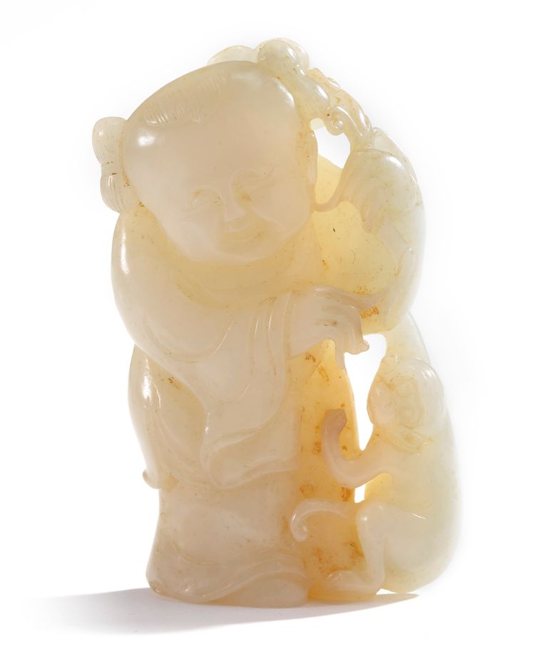 A Chinese pale cream jade 'boy and monkey' group