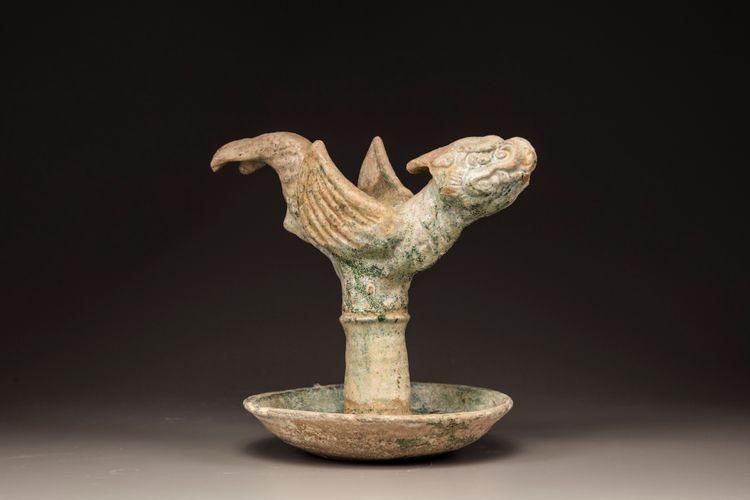 A Chinese green-glazed dragon-carp oil lamp