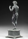 A ROMAN BRONZE STATUETTE OF APOLLO CARNEUS, CIRCA 1ST-2ND CENTURY A.D.