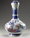 A Chinese copper-red-decorated blue and white garlic-head vase