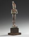 AN EGYPTIAN BRONZE OSIRIS STATUE, 26TH DYNASTY, CIRCA 664–525 B.C.