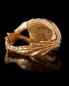 A ROMAN STYLE GOLD RING WITH A GREEN STONE, 3RD-4TH CENTURY AD OR LATER