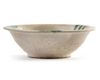 AN ABBASID TIN GLAZED POTTERY BOWL, MESOPOTAMIA, 9TH CENTURY