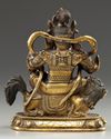 A Sino-Tibetan gilt bronze figure of Jambhala