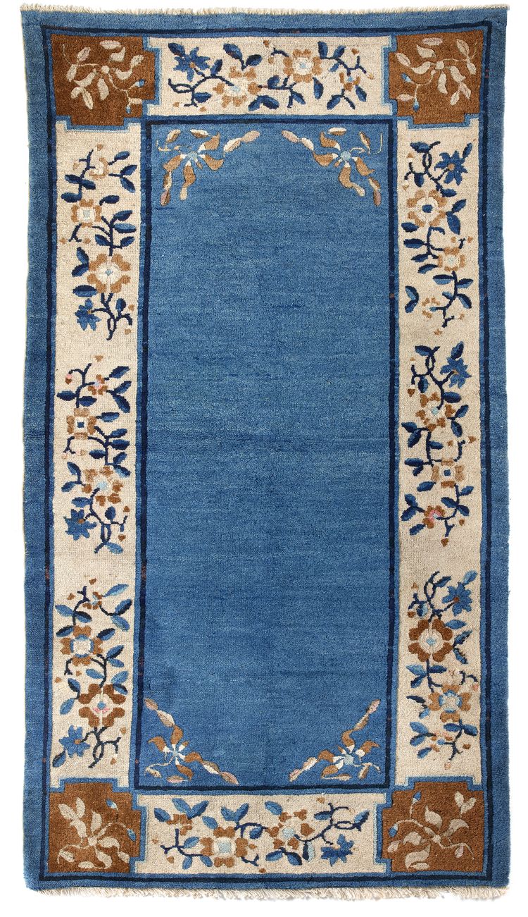 A CHINESE WOOL PEKING RUG, 20TH CENTURY