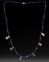 AN EGYPTIAN LOTUS FLOWER LAPIS LAZULI AMULET NECKLACE, CIRCA 1550-1570 B.C.
