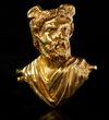 A ROMAN REPOUSSÉ GOLD BUST OF A MAN WITH WINGED HEAD, CIRCA 2ND CENTURY A.D.