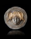 A ROMAN GILT SILVER PHALERA WITH WINGED HEAD OF MEDUSA, 1ST-2ND CENTURY AD