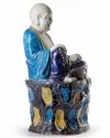 A CHINESE FAHUA GLAZED FIGURE OF BUDAI, CHINA, QING DYNASTY (1644-1911)