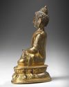 A SINO-TIBETAN GILT BRONZE FIGURE OF SHAKYAMUNI