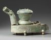 A CHINESE GREEN-GLAZED POTTERY STOVE WITH A DRAGON CHIMNEY