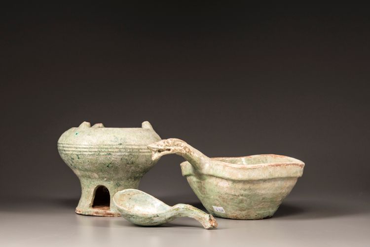 A GREEN-GLAZED RED POTTERY MODEL OF A YI, A LADLE AND BRAZIER, HAN DYNASTY (206 BC - 220 AD)