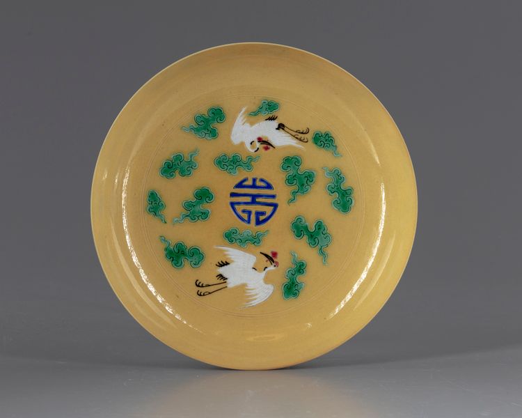 A CHINESE CRANES YELLOW DISH, 20TH CENTURY