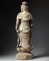A LARGE CHINESE POLYCHROME-DECORATED WOOD CARVING OF GUANYIN, POSSIBLY SONG-YUAN DYNASTY