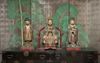 An important and rare set of three polychrome painted wooden figures
