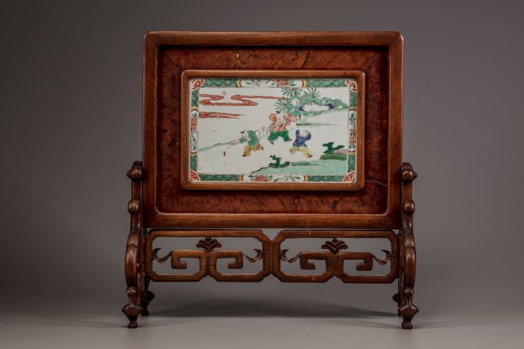 A famille verte 'boys' plaque mounted as a table screen