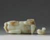 A CHINESE CELADON AND RUSSET JADE BUDDHIST LION WATER DROPPER, CHINA, QING DYNASTY (1644-1911)