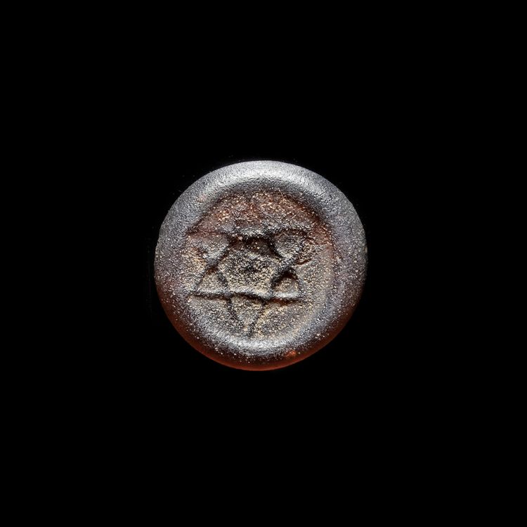 A FATIMID GLASS WEIGHT OF DIRHAM, EGYPT 10TH-11TH CENTURY