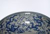 A LARGE CHINESE BLUE AND WHITE DRAGONS DISH, MING DYNASTY (1368-1644) OR LATER
