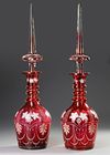 PAIR OF ANTIQUE RUBY RED GLASS DECANTERS, 19TH CENTURY