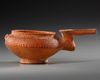 AN AMLASH TERRACOTTA PAINTED SPOUTED VESSEL, CIRCA EARLY 1ST MILLENNIUM B.C.